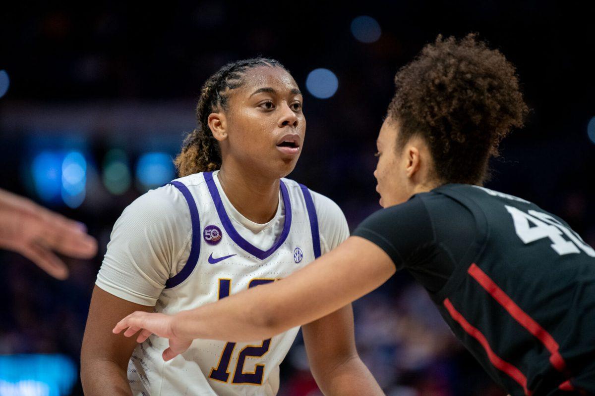 LSU women's basketball sophomore guard Mikaylah Williams (12) watches the referee during LSU's 94-88 overtime win against Stanford on Thursday, Dec. 5, 2024, in the Pete Maravich Assembly Center in Baton Rouge, La.