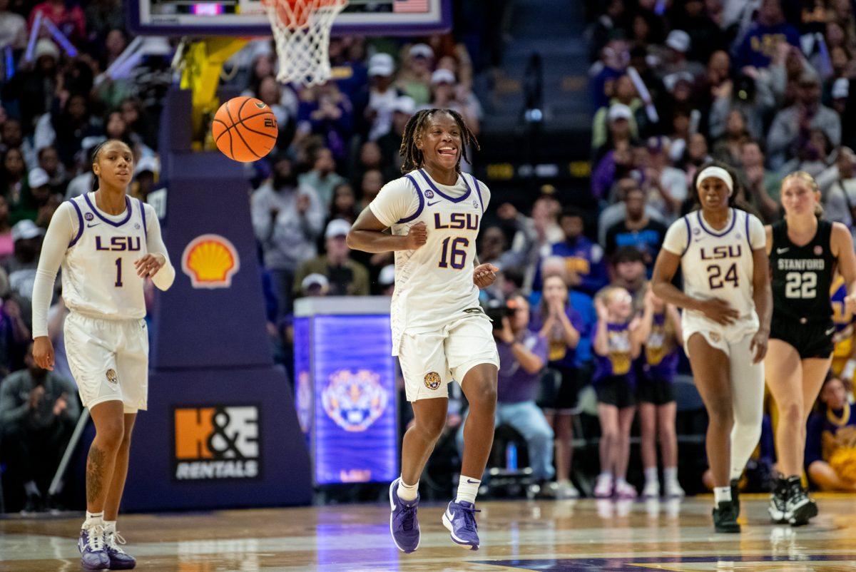 LSU women's basketball junior guard Kailyn Gilbert (16) is excited at the beginning of overtime during LSU's 94-88 win against Stanford on Thursday, Dec. 5, 2024, in the Pete Maravich Assembly Center in Baton Rouge, La.