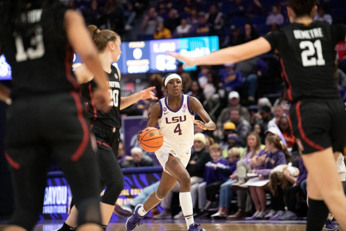 LSU women's basketball junior guard Flau&#8217;Jae Johnson (4) dribbles the ball during LSU's 94-88 overtime win against Stanford on Thursday, Dec. 5, 2024, in the Pete Maravich Assembly Center in Baton Rouge, La.