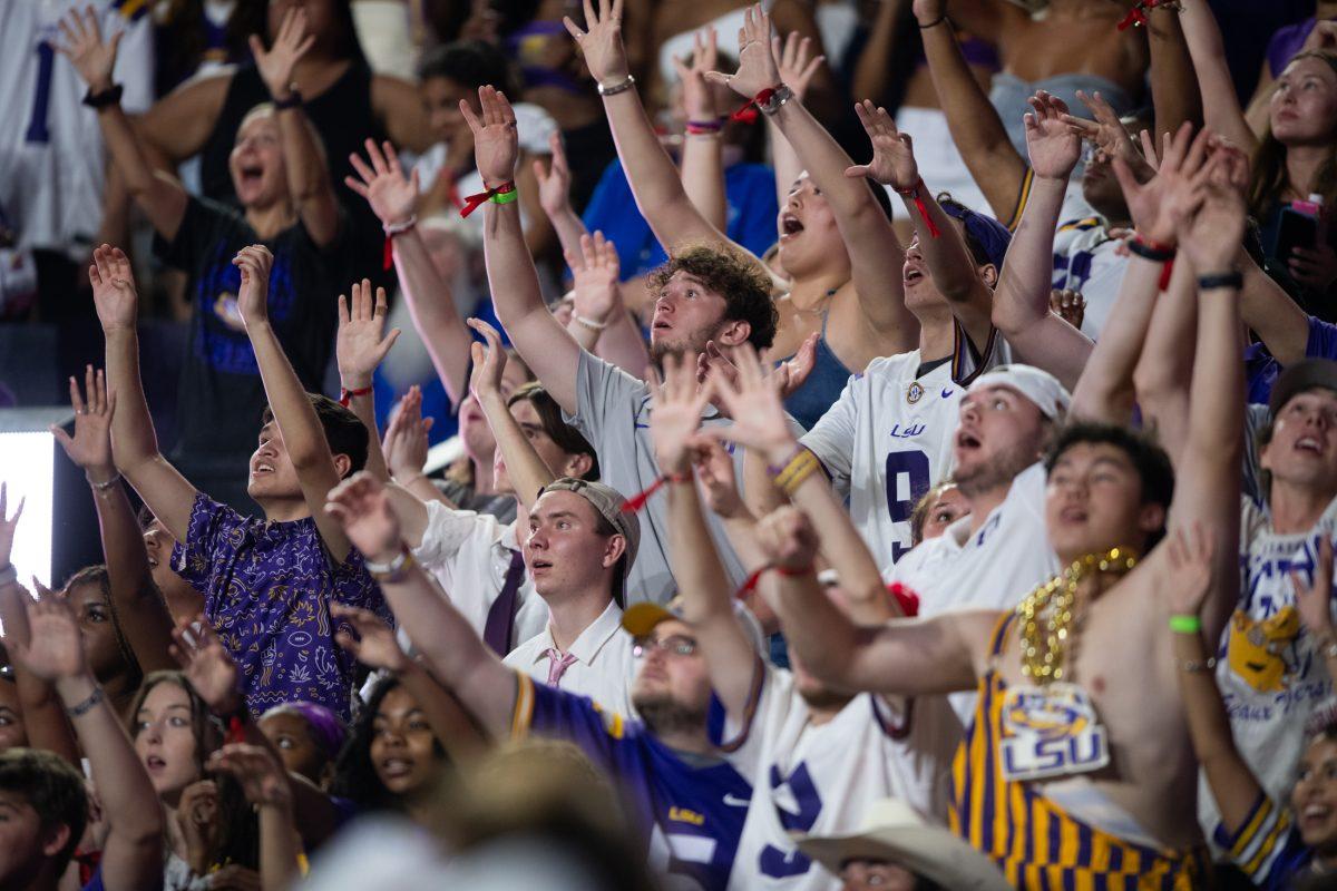 The crowd raises their hands and cheers on Saturday, Sept. 7, 2024, during LSU's 44-21 win against Nicholls at Tiger Stadium in Baton Rouge, La.