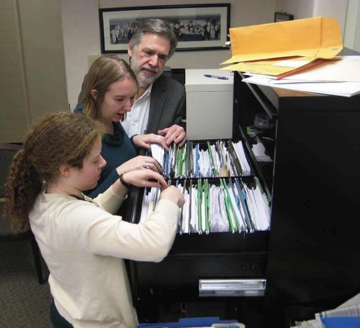 Stanley Nelson, Marylee Williams and Olivia McClure comb through some of the LSU Cold Case files during work on campus in 2014.&#160;