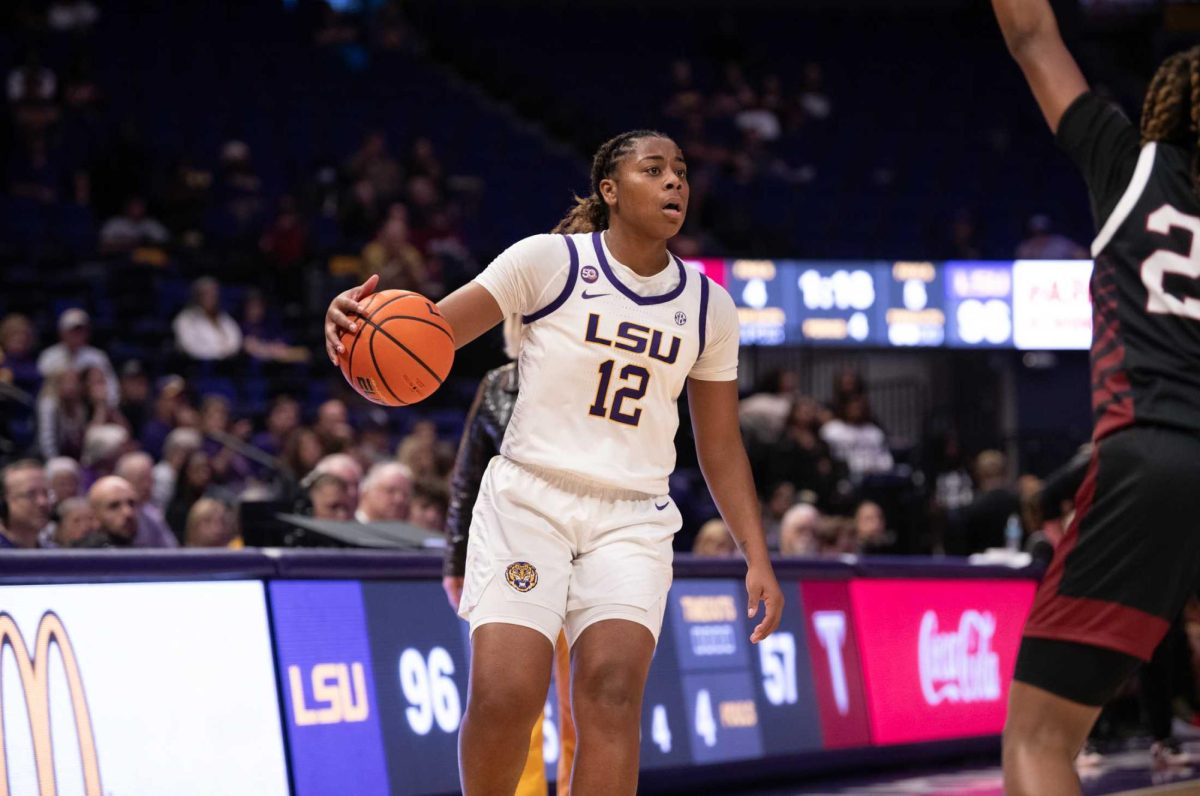 LSU women's basketball sophomore guard Mikaylah Williams (12) looks for a pass during LSU's 98-59 win against Troy on Monday, Nov. 19, 2024, in the Pete Maravich Assembly Center in Baton Rouge, La.