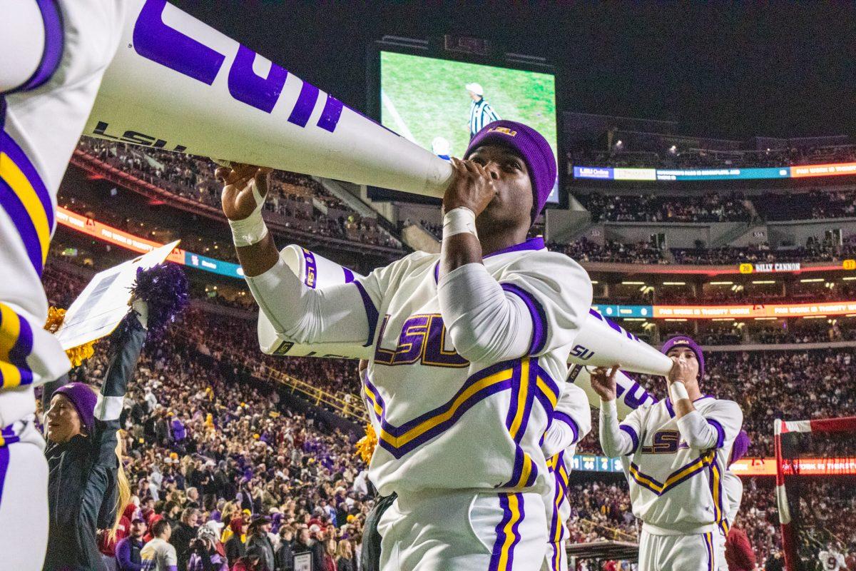 An LSU cheerleader yells into a megaphone Saturday, Nov. 30, 2024, during LSU's 37-17 win over Oklahoma at Tiger Stadium in Baton Rouge, La.