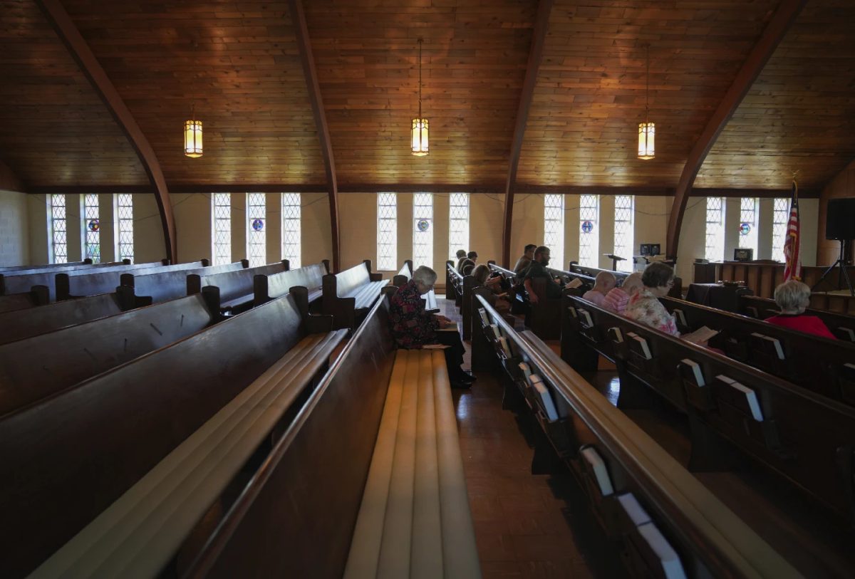 Roughly a dozen people attend pastor Ryan Burge's Sunday service at First Baptist Church in Mt. Vernon, III., Sept. 10, 2023. 