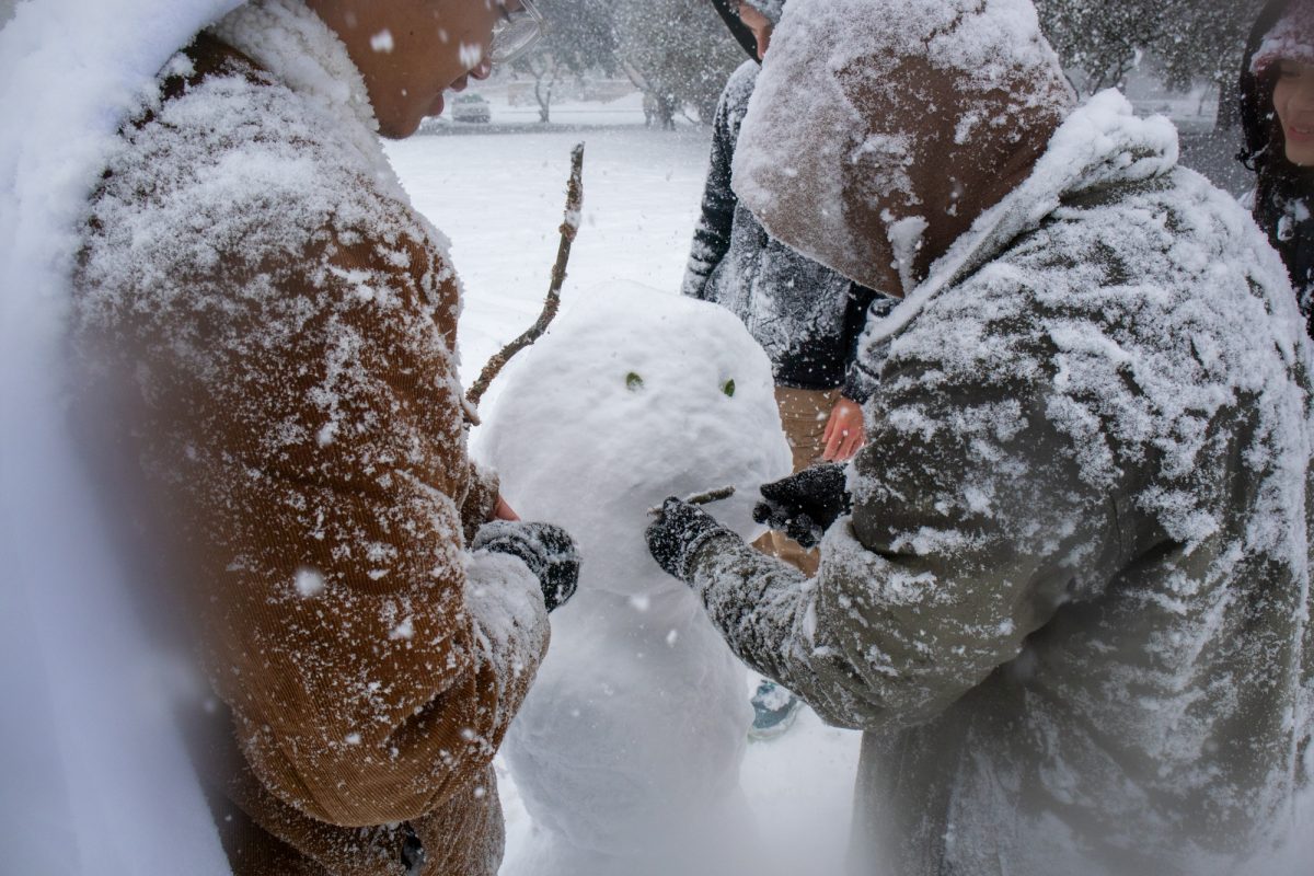 LSU students build a snowman Tuesday, Jan. 21, 2025 on the Parade Grounds in Baton Rouge, La.