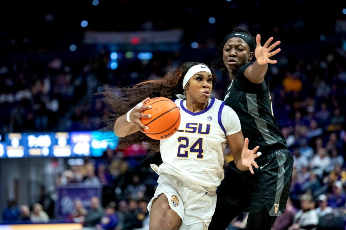 LSU women's basketball senior forward Aneesah Morrow (24) attempts to evade a Vanderbilt player and score during LSU's 83-77 win against Vanderbilt on Monday, Jan. 13, 2025, in the Pete Maravich Assembly Center in Baton Rouge, La.