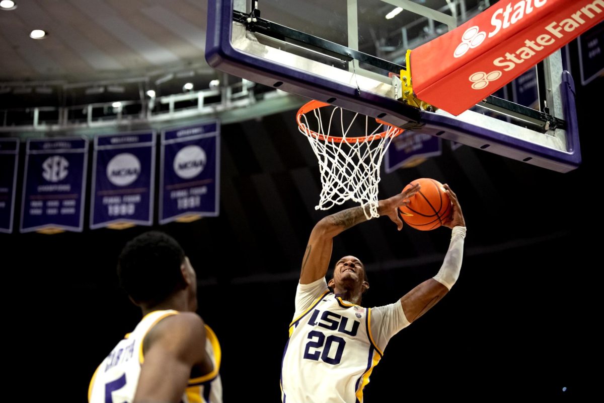 LSU men's basketball 5th-year senior forward Derek Fountain (20) attempts to score during LSU's 78-74 win against Arkansas on Tuesday, Jan. 14, 2025, in the Pete Maravich Assembly Center in Baton Rouge, La.