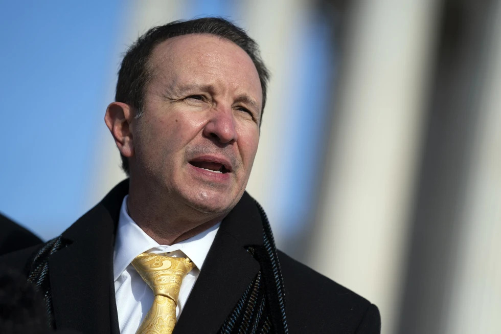 Louisiana Attorney General Jeff Landry talks to reporters outside the Supreme Court, Jan. 7, 2022, in Washington.