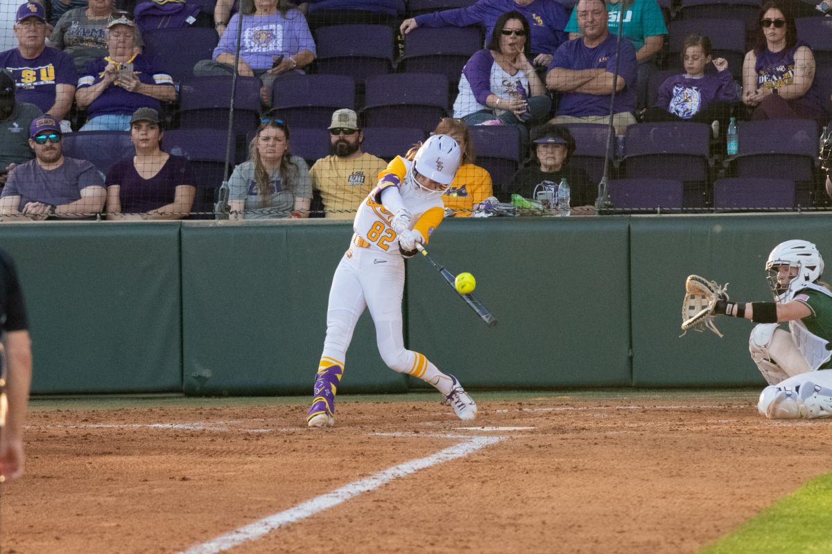 LSU softball junior infielder Avery Hodge (82) hits the ball during LSU's 8-0 mercy win against the Charlotte 49ers on Feburary 7, 2025, at Tiger Park in Baton Rouge, La.