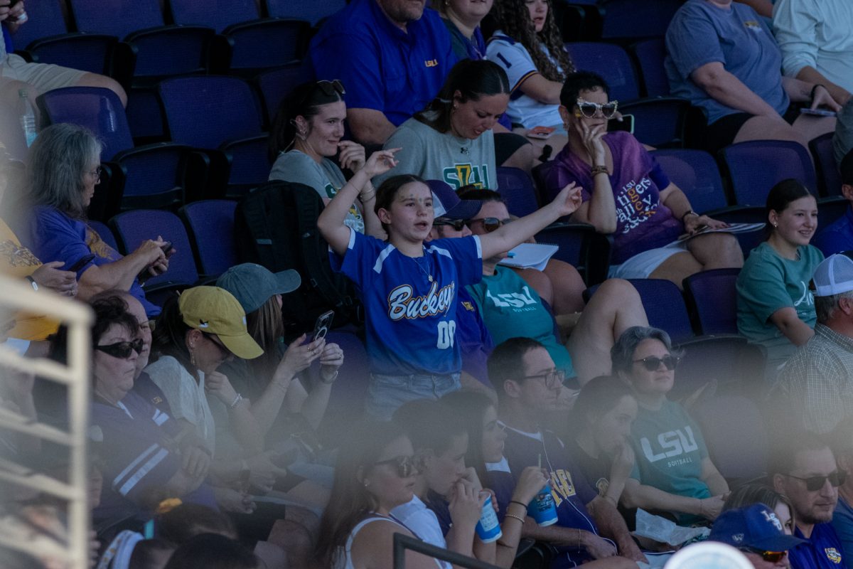 A young LSU softball fan dancing for a chance to win "Caniac Maniac" during LSU's 3-2 win against Southeastern on Feb 9, 2025, in Baton Rouge, La.