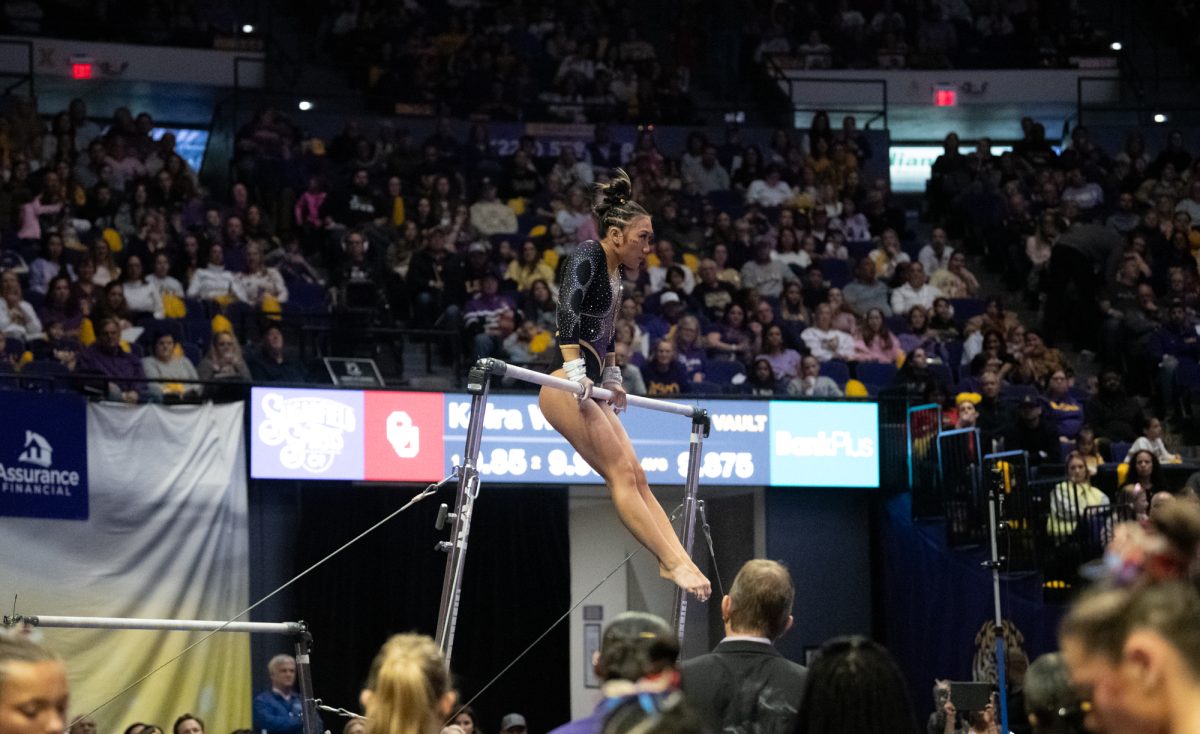 LSU gymnastics all-around freshman Kailin Chio competes on bars during LSU's 198.050-197.675 win against Oklahoma on Friday, Feb. 14, 2025, at the Pete Maravich Assembly Center in Baton Rouge, La.