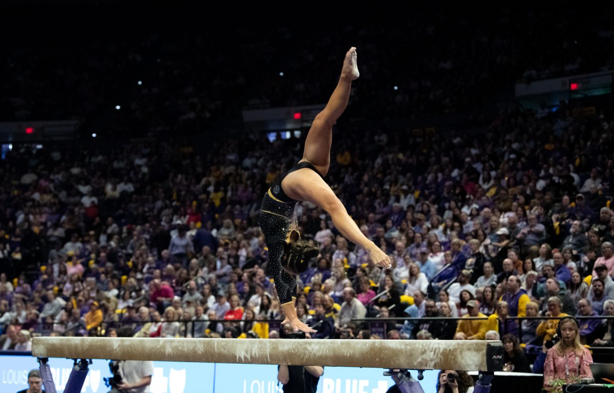 LSU gymnastics all-around freshman Kailin Chio competes on beam during LSU's 198.050-197.675 win against Oklahoma on Friday, Feb. 14, 2025, at the Pete Maravich Assembly Center in Baton Rouge, La.