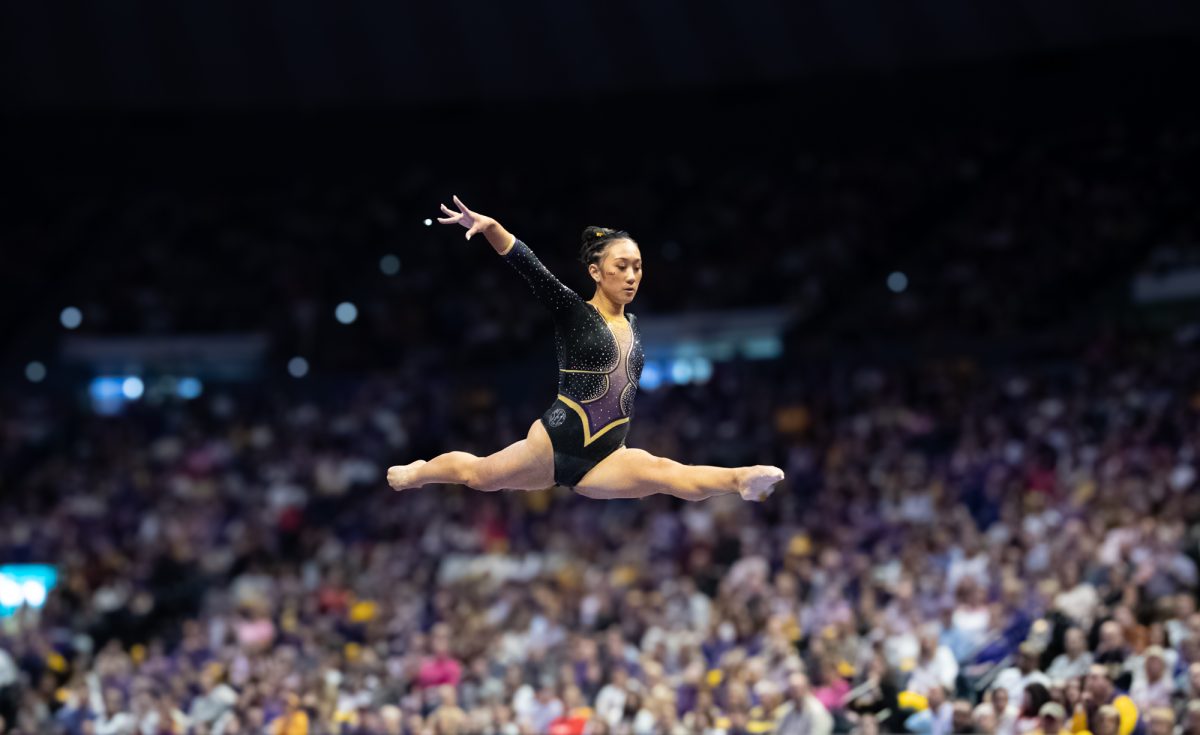 LSU gymnastics all-around freshman Kailin Chio jumps on beam during LSU's 198.050-197.675 win against Oklahoma on Friday, Feb. 14, 2025, at the Pete Maravich Assembly Center in Baton Rouge, La.