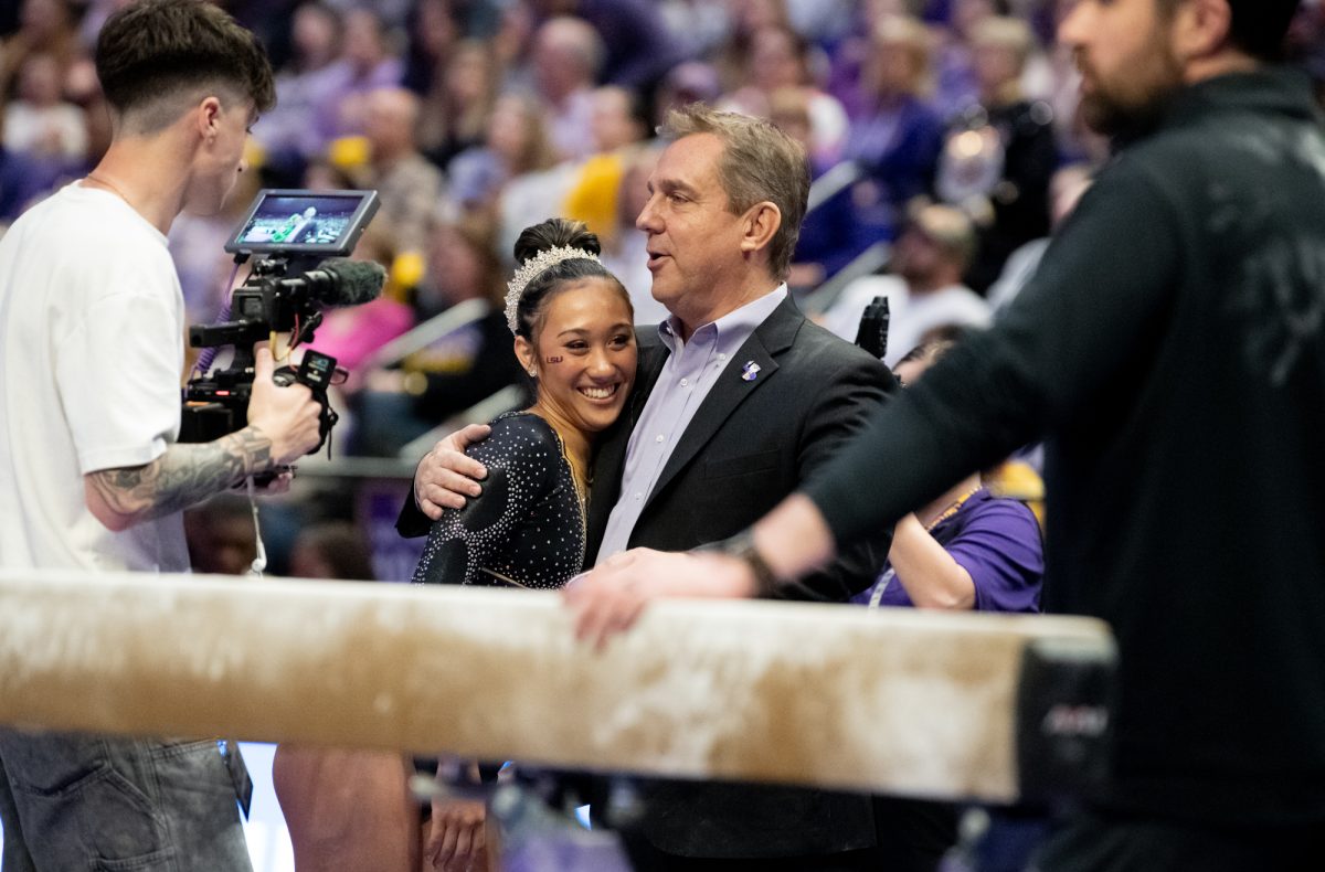 LSU gymnastics all-around freshman Kailin Chio celebrates after her beam performance during LSU's 198.050-197.675 win against Oklahoma on Friday, Feb. 14, 2025, at the Pete Maravich Assembly Center in Baton Rouge, La.