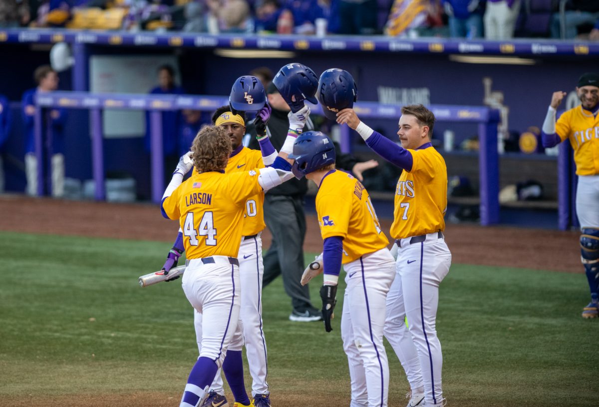 LSU baseball players celebrate after Ashton Larson (44) hits a home run during LSU's 8-1 win against Purdue Fort Wayne on Sunday, Feb. 16, 2025, at Alex Box Stadium on Gourrier Avenue in Baton Rouge, La.