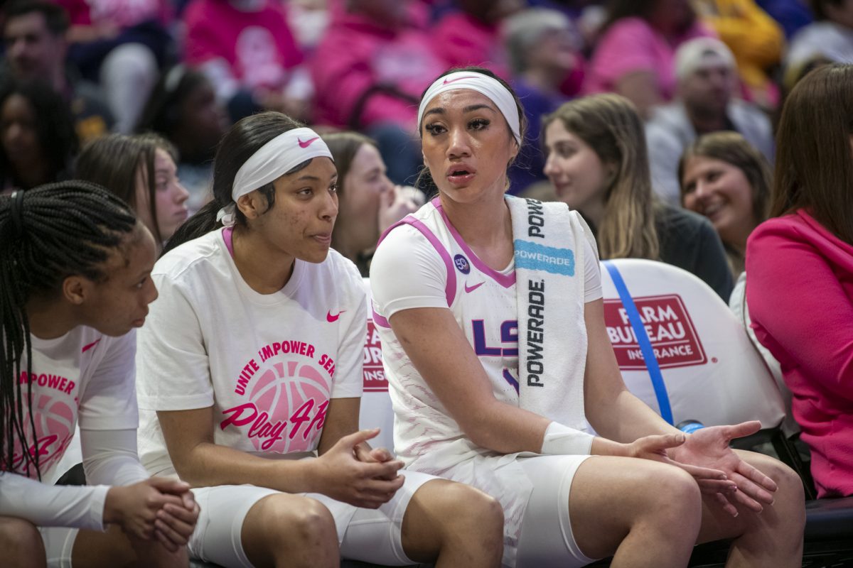 LSU women's basketball freshman guard Jada Richard (30) and senior guard Last-Tear Poa (13) talk on the bench Thursday, Feb. 20, 2025, during their 79-63 win against Georgia at the Pete Maravich Assembly Center in Baton Rouge, La.