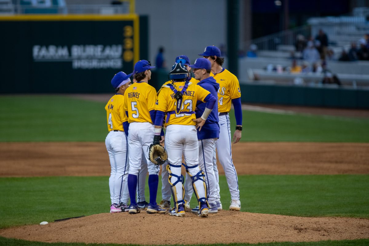 LSU baseball infield meets Coach Jay Johnson for a mound visit Saturday, Feb. 22, 2025, during LSU's 12-1 win over Omaha.