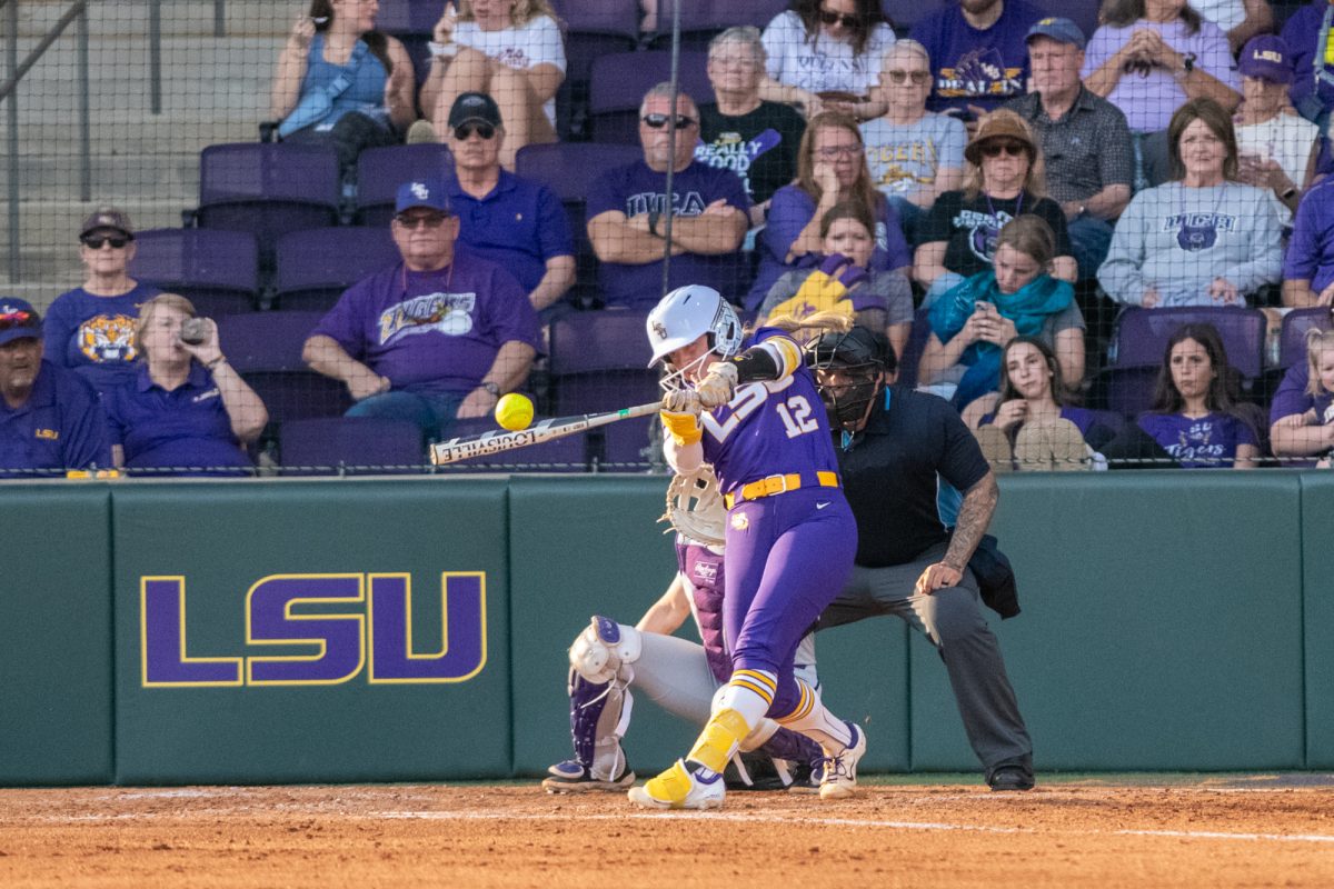 LSU softball junior catcher Maci Bergeron (12) hits the ball Saturday, Feb. 8, 2025, during LSU's 6-0 win against Central Arkansas at Tiger Park in Baton Rouge, La.