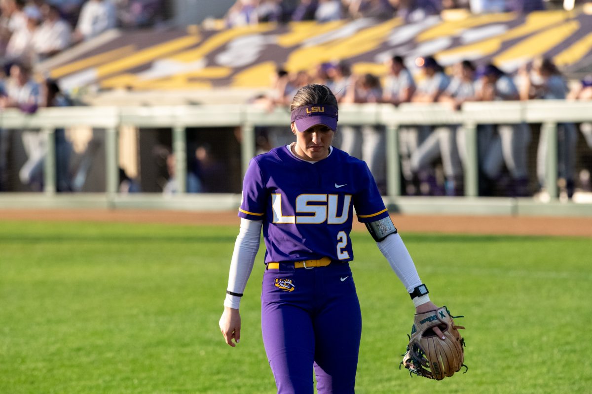 LSU softball sophomore left fielder Maddox McKee (2) walks in the outfield Saturday, Feb. 8, 2025, during LSU's 6-0 win against Central Arkansas at Tiger Park in Baton Rouge, La.