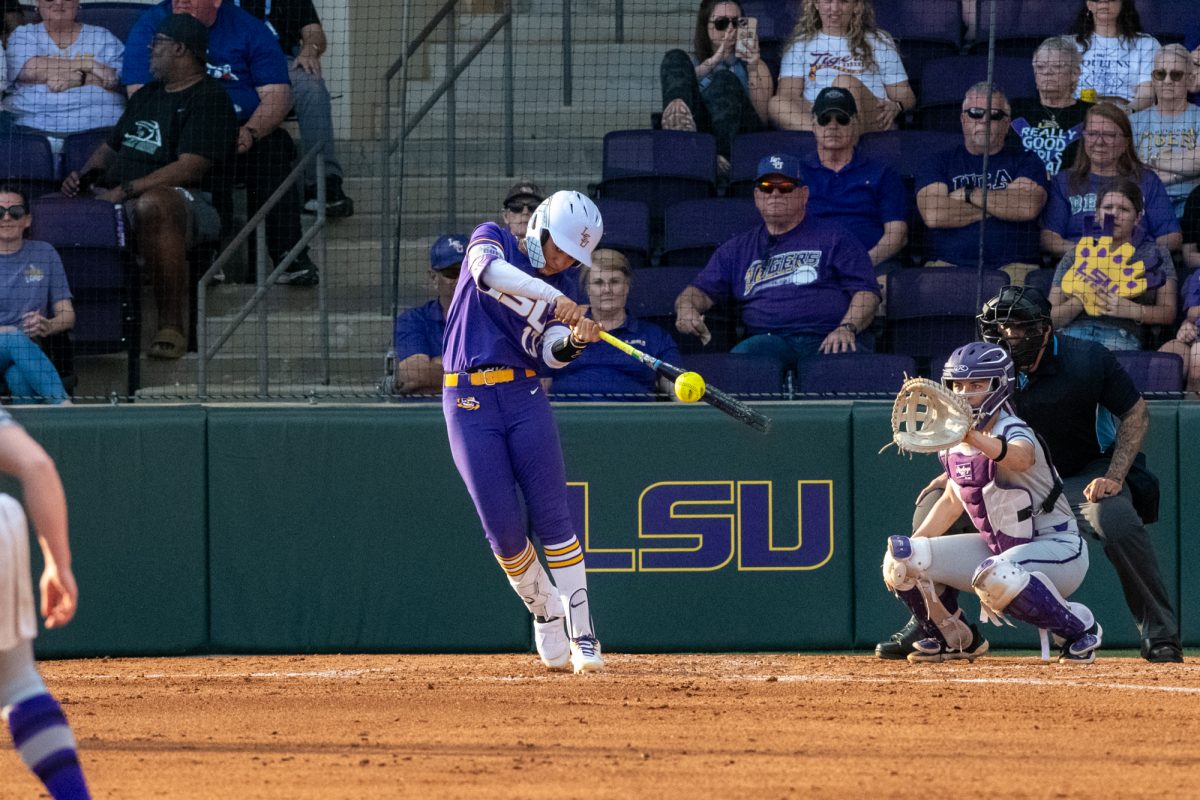 LSU softball redshirt senior third baseman Danieca Coffey slaps the ball Saturday, Feb. 8, 2025, during LSU's 6-0 win against Central Arkansas at Tiger Park in Baton Rouge, La.