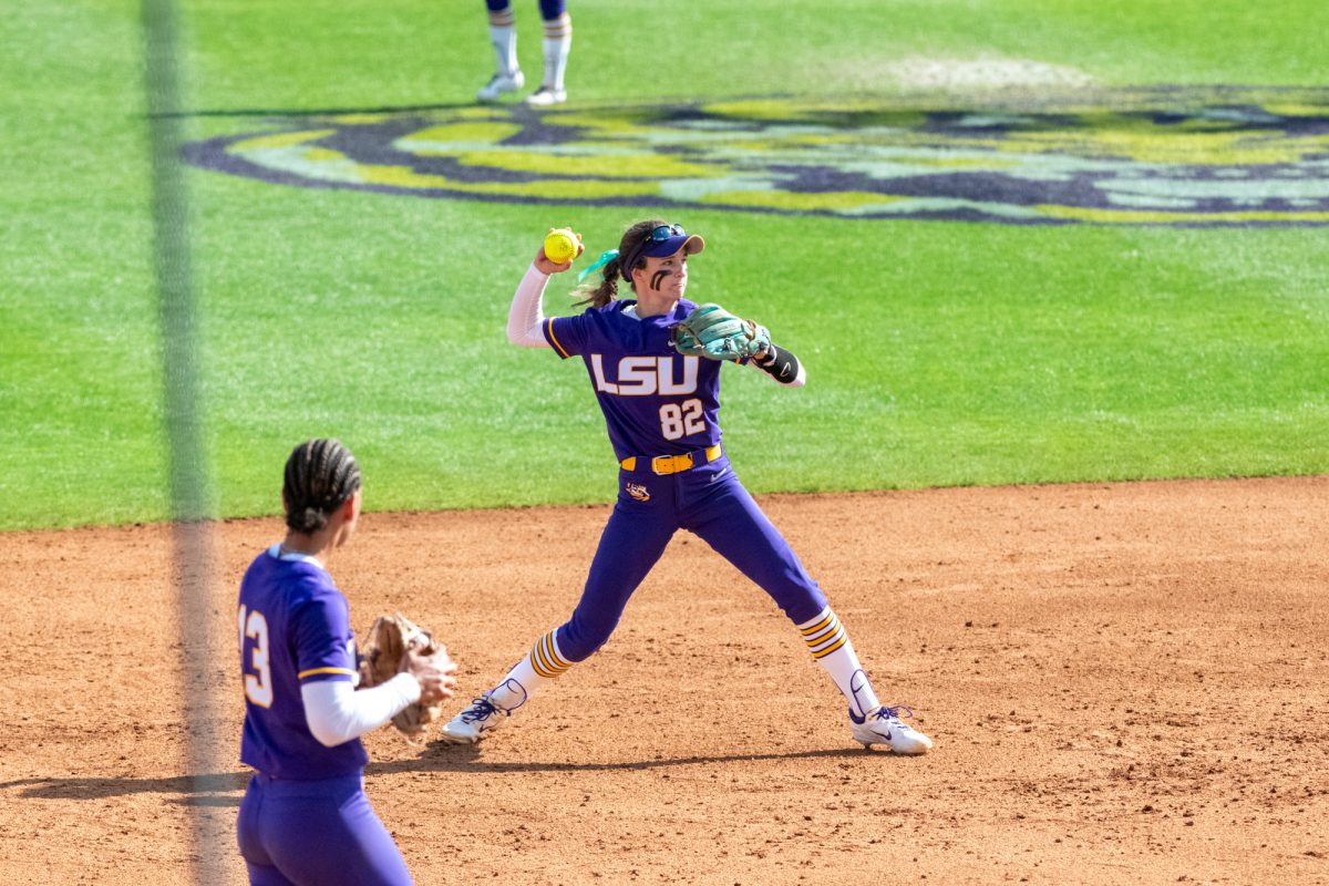 LSU softball junior short stop Avery Hodge (82) throws the ball Saturday, Feb. 8, 2025, during LSU's 10-0 win against Charlotte at Tiger Park in Baton Rouge, La.