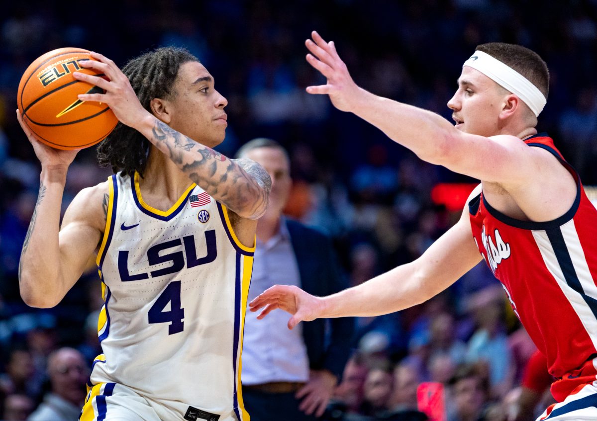 LSU men’s basketball graduate student guard Dji Bailey (4) looks past Ole Miss men’s basketball senior guard Sean Pedulla (3) during LSU's 70-72 loss against Ole Miss on Saturday, Feb. 9, 2025, in the Pete Maravich Assembly Center in Baton Rouge, La.