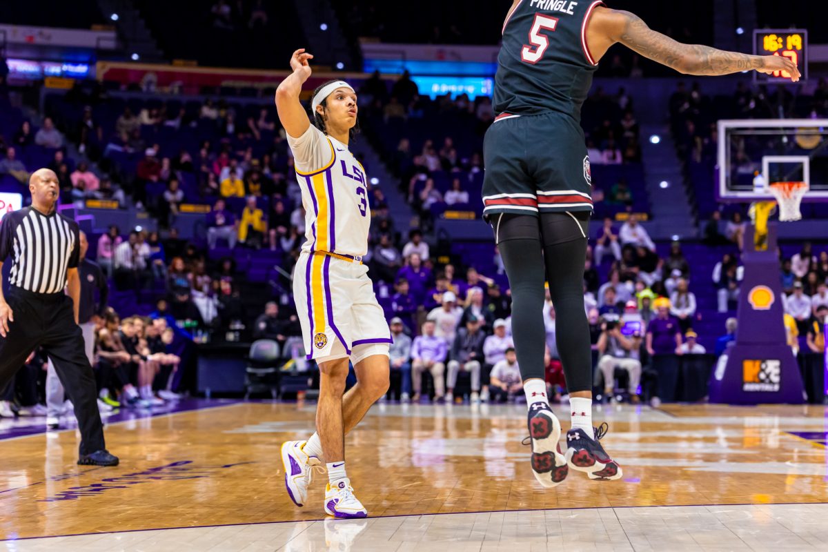 LSU men’s basketball freshman guard Curtis Givens III (3) shoots a three pointer during LSU's 81-67 win against South Carolina on Tuesday, Feb. 18, 2025, in the Pete Maravich Assembly Center in Baton Rouge, La.