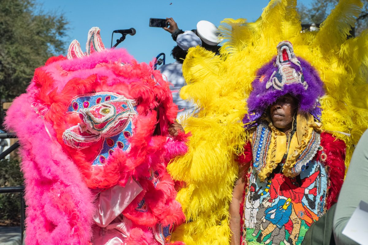 Entertainers wear intricately beaded traditional Mardi Gras costumes during LSU's Mardi Gras Mambo on Feb 25, 2025 on Tower Drive in Baton Rouge, La.