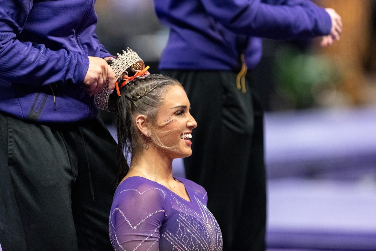 LSU gymnastics all-around senior KJ Johnson accepts the crown after a successful vault jump during the LSU 198.000-197.175 win against Missouri on Friday, January 31, 2025, at the Pete Maravich Assembly Center in Baton Rouge, LA.