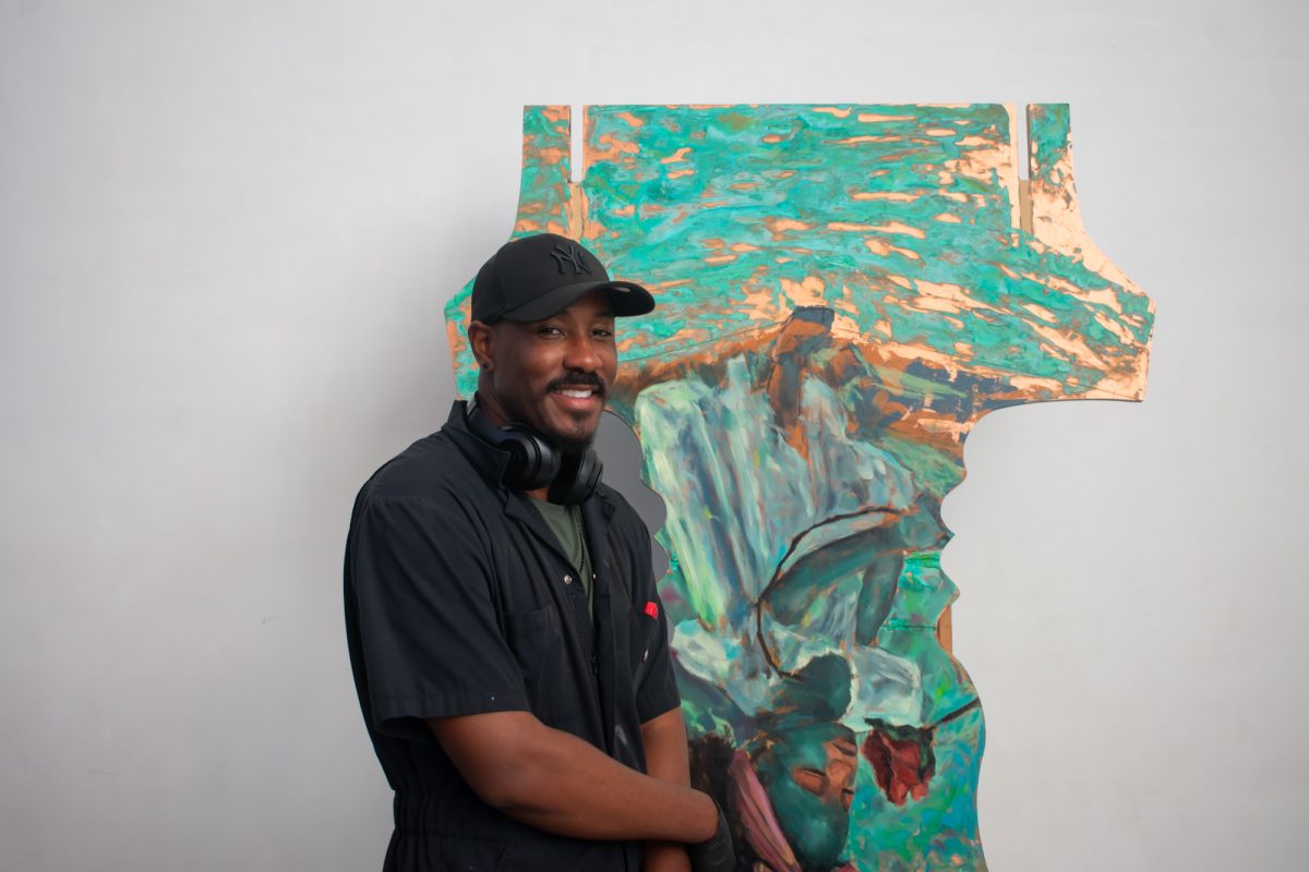 Artist Mike Weary stands with his painting Sunday, Feb. 2, 2025, during the Black History Month celebration at the LSU Museum of Art in Baton Rouge, La.