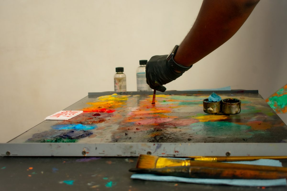 Artist Mike Weary selects colors for his live art demonstration Sunday, Feb. 2, 2025, during the Black History Month celebration at the LSU Museum of Art in Baton Rouge, La.