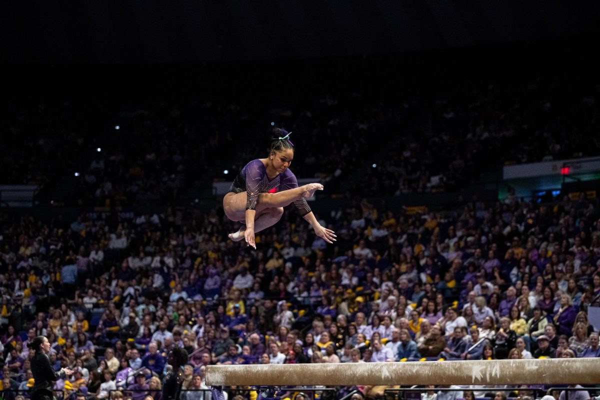 LSU gymnastics all-around sophomore Konnor McClain jumps on the beam during the LSU 198.000-197.175 win against Missouri on Friday, January 31, 2025, at the Pete Maravich Assembly Center in Baton Rouge, LA.