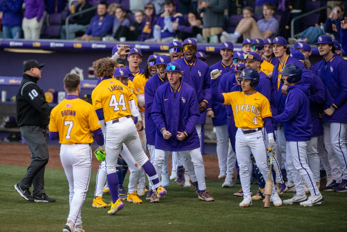 LSU baseball players celebrate after Ashton Larson (44) hits a home run during LSU's 8-1 win against Purdue Fort Wayne on Sunday, Feb. 16, 2025, at Alex Box Stadium on Gourrier Avenue in Baton Rouge, La.