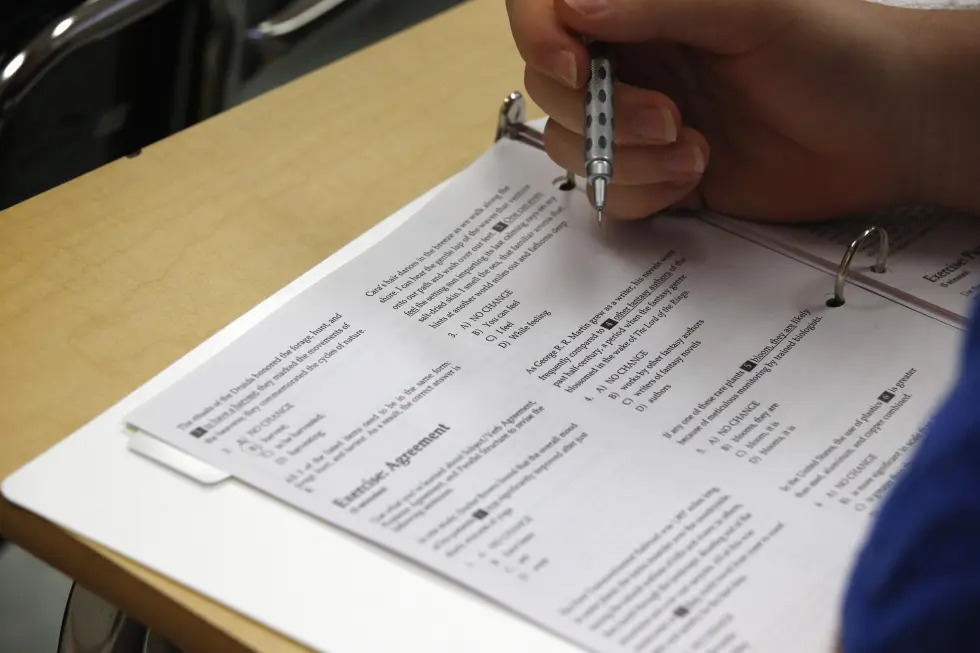 In this photo taken Jan. 17, 2016, a student looks at questions during a college test preparation class at Holton Arms School in Bethesda, Md. 