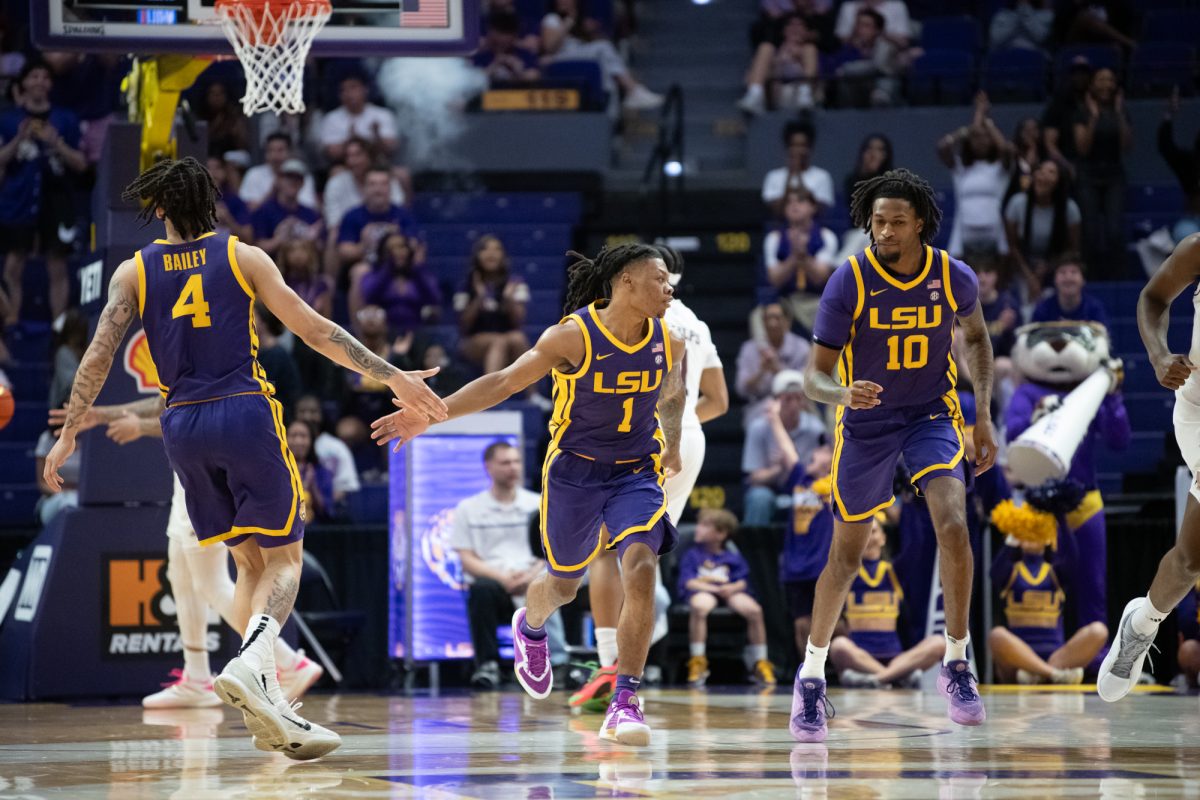 LSU men's basketball 5th-year-senior guard Jordan Sears (1) high-fives a teammate during LSU's 66-52 loss to Texas A&amp;M on Saturday, March 8, 2025, in the Pete Maravich Assembly Center in Baton Rouge, La.