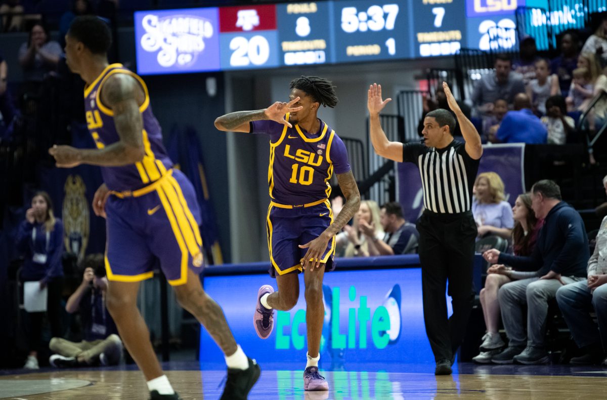 LSU men's basketball redshirt junior forward Daimion Collins (10) celebrates after a teammate scores a three-pointer during LSU's 66-52 loss to Texas A&amp;M on Saturday, March 8, 2025, in the Pete Maravich Assembly Center in Baton Rouge, La.