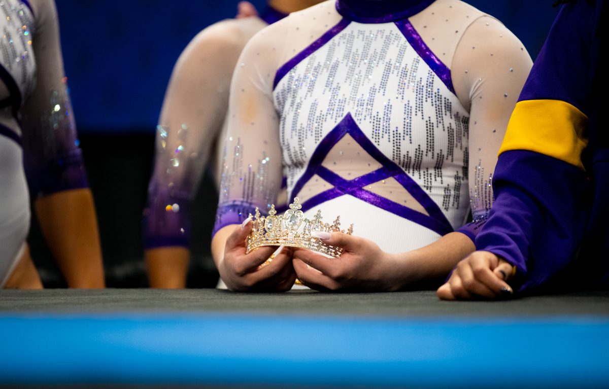 An LSU gymnastics member holds the crown during LSU's SEC Championship win on Saturday, March 22, 2025, at the Legacy Arena in Birmingham, Al.