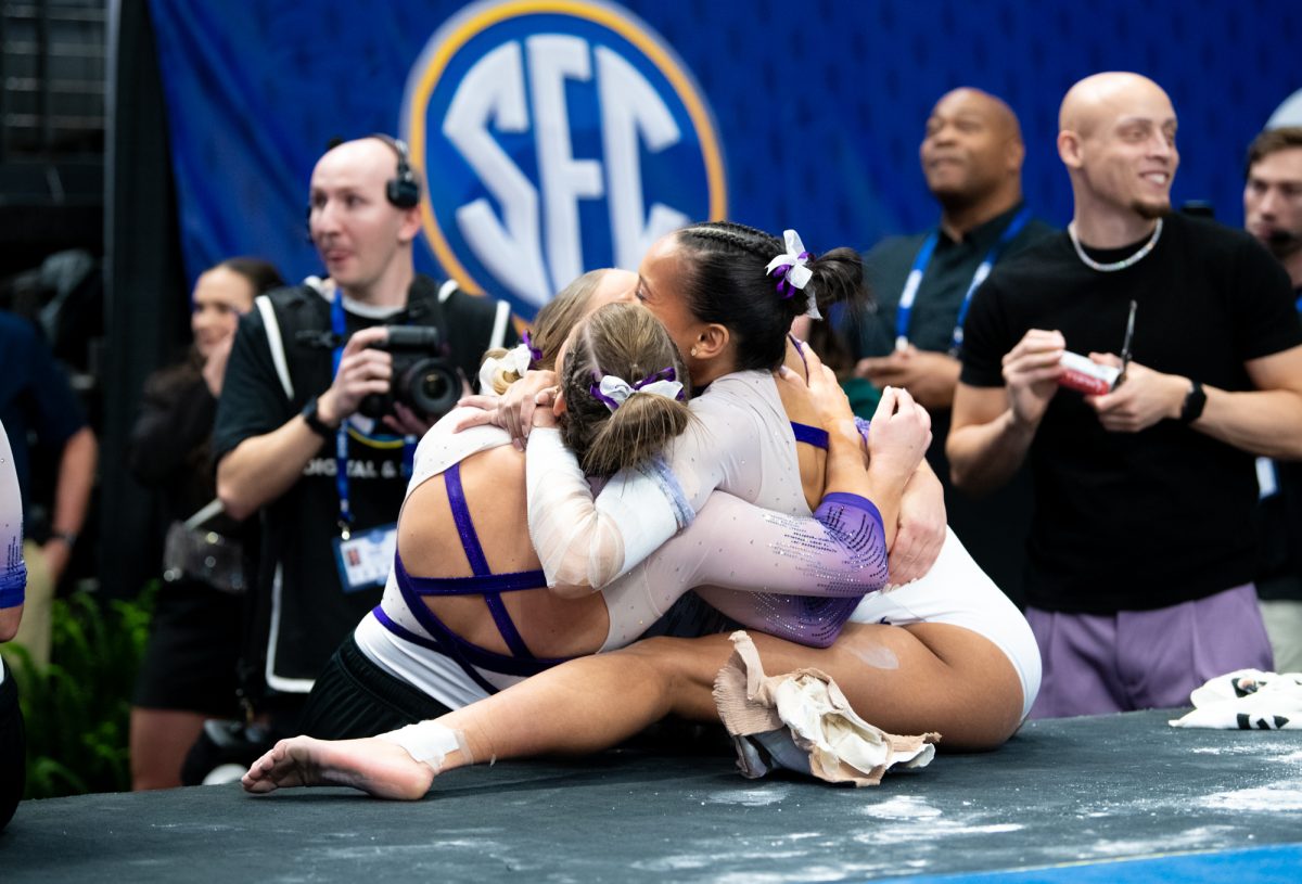 LSU gymnasts celebrate after realizing they had won during LSU's SEC Championship win on Saturday, March 22, 2025, at the Legacy Arena in Birmingham, Al.