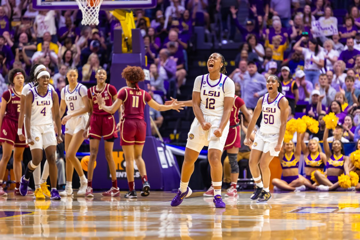 LSU women’s basketball sophomore guard Mikaylah Williams (12) and LSU women's basketball senior guard Shayeann Day-Wilson (50) celebrate Willliams' shot during LSU's 101-71 March Madness win against Florida State on Monday, March. 24, 2025, in the Pete Maravich Assembly Center in Baton Rouge, La.