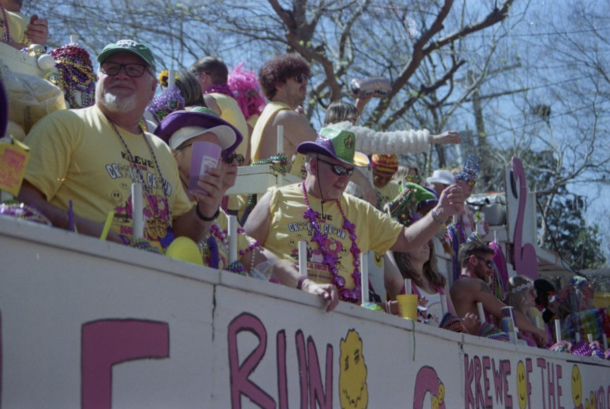 Float riders throw Saturday, March 1, 2025, on Spanishtown Street in Baton Rouge, La.