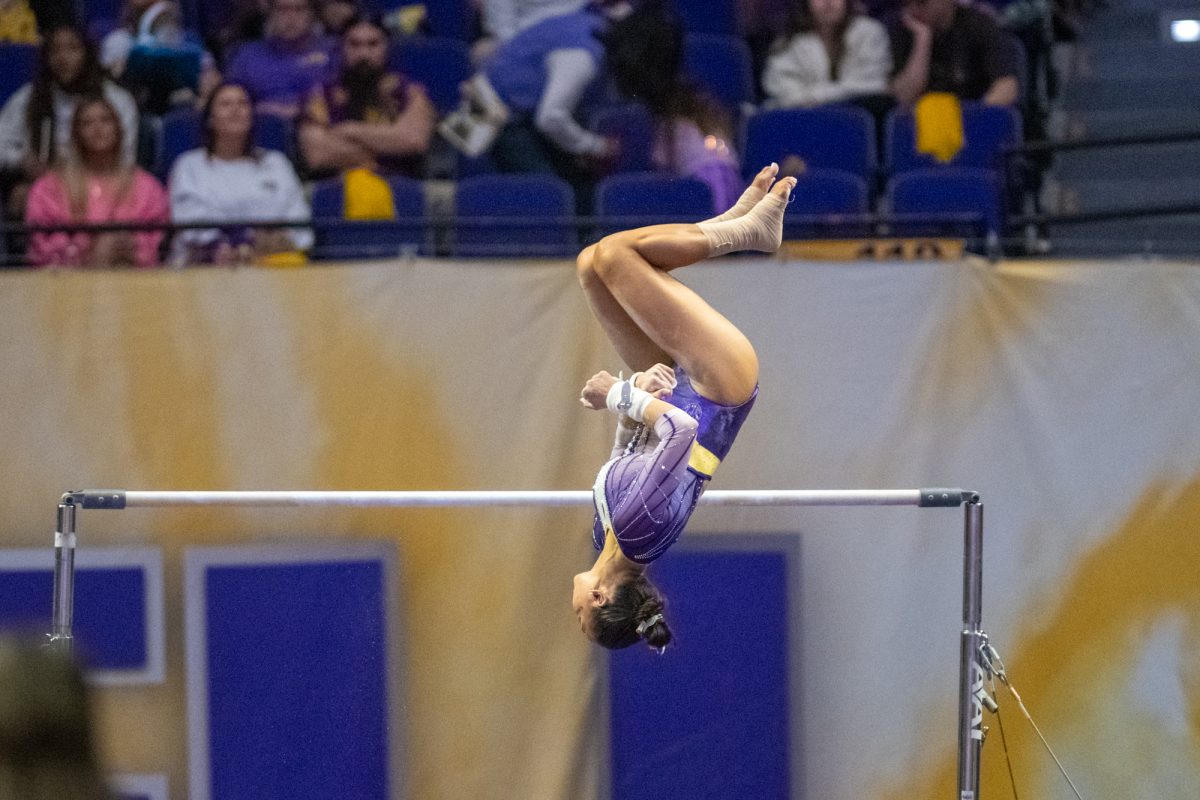 LSU gymnastics all around senior Aleah Finnegan dismounts the bars Friday, March 7, 2025 during LSU's 198.575-197.175 win over Georgia in the Pete Maravich Assembly Center in Baton Rouge, La.