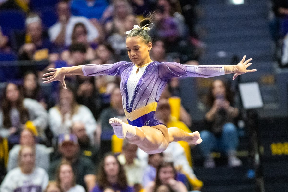 LSU gymnastics all around graduate student Haleigh Bryant split jumps on the beam Friday, March 7, 2025 during LSU's 198.575-197.175 win over Georgia in the Pete Maravich Assembly Center in Baton Rouge, La.