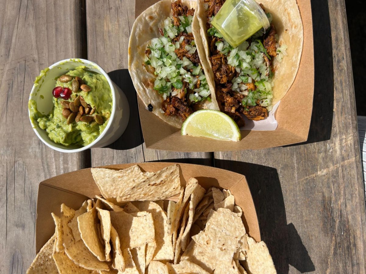 Two chicken tacos and a side of chips and guacamole at Barracuda Taco Stand in Baton Rouge, La.