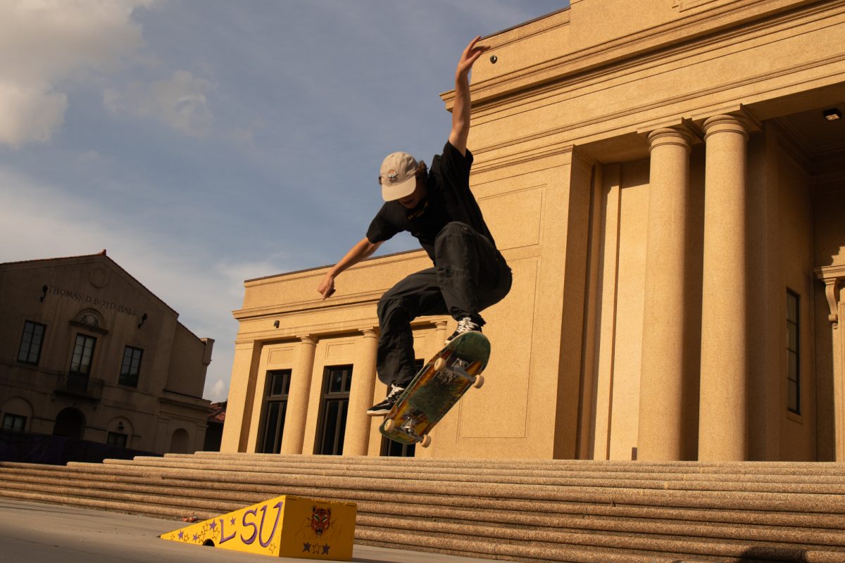 Skate Club LSU member jumps the ramp Friday, April 26, 2024, at the Memorial Tower in Baton Rouge, La.