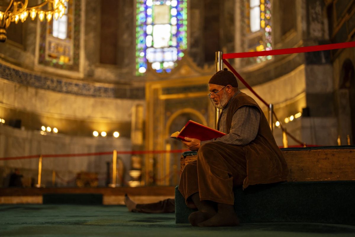 A Muslim worshipper reads the Quran, Islam's holiest book in Istanbul, Turkey, Tuesday, March 12, 2024.