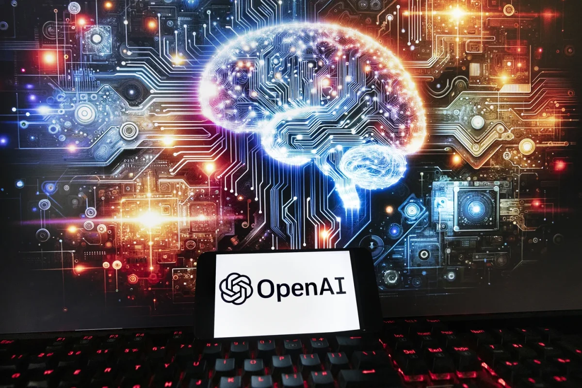 The OpenAI logo is displayed on a cellphone with an image on a computer monitor generated by ChatGPT, Friday, Dec. 8, 2023 in Boston, Mass.