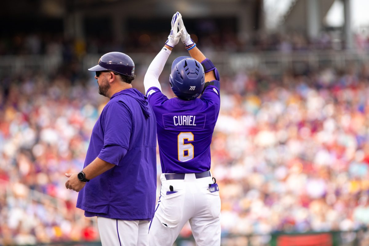 LSU baseball freshman outfielder Derek Curiel (6) celebrates on first base during LSU’s 4-1 win over Arkansas during the  Men’s College World Series Saturday, June 14, 2025, at Charles Schwab Field on Mike Fahey Street in Omaha, Ne.