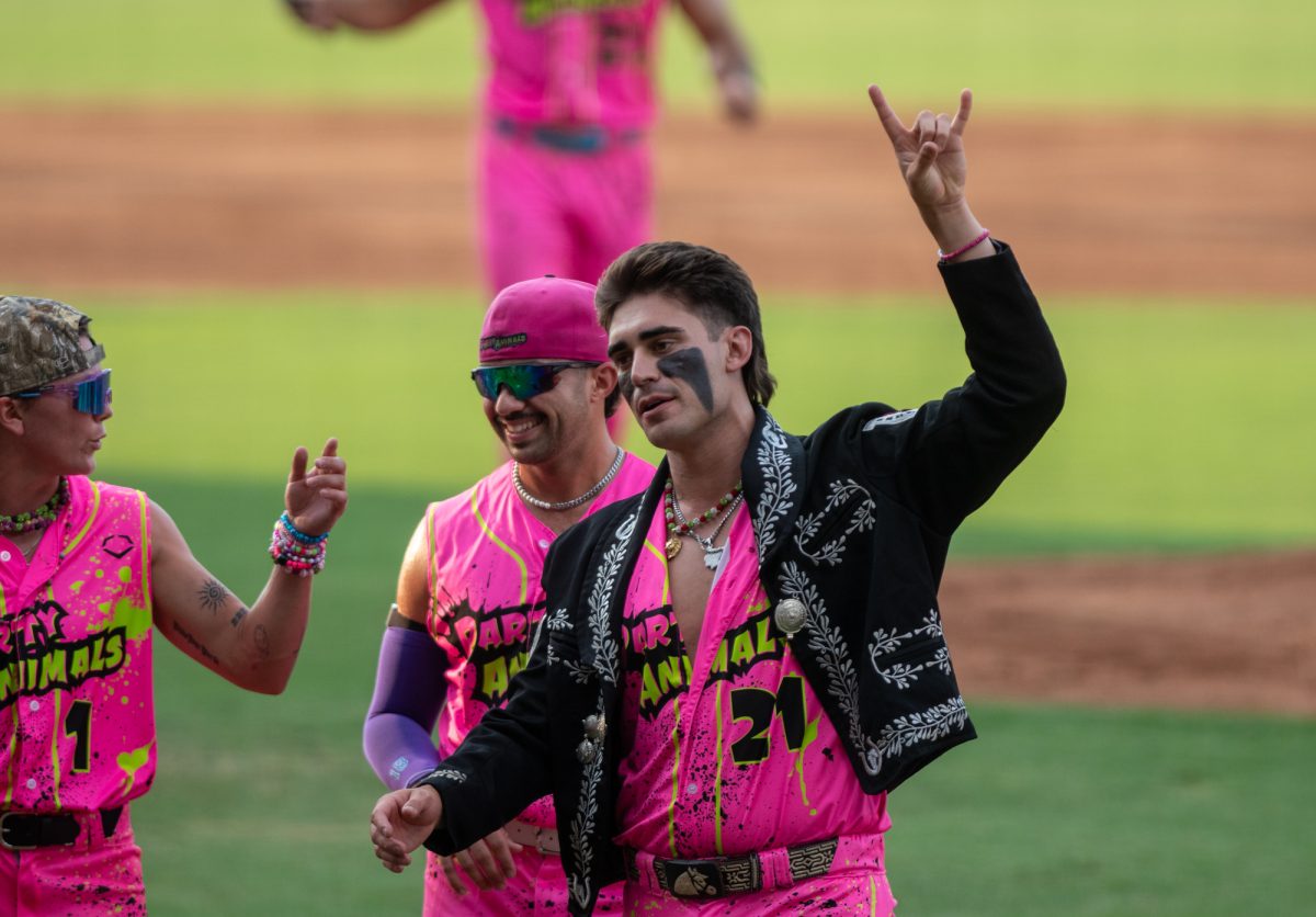 A Party Animal holds up a “Rock ‘n Roll” hand sign Friday, Aug 8, 2025, at Alex Box Stadium in Baton Rouge, La.