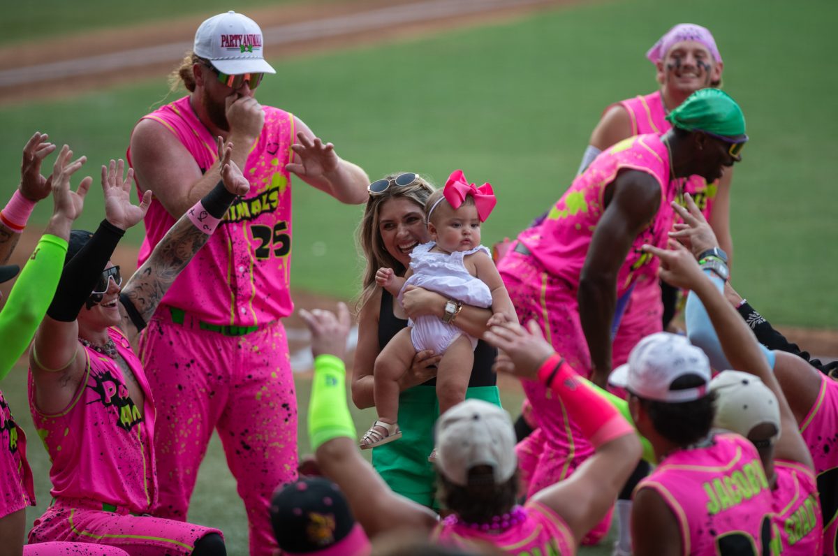 A baby is paraded on the field before the Party Animals vs Texas Tailgaters matchup Friday, Aug 8, 2025, at Alex Box Stadium in Baton Rouge, La.