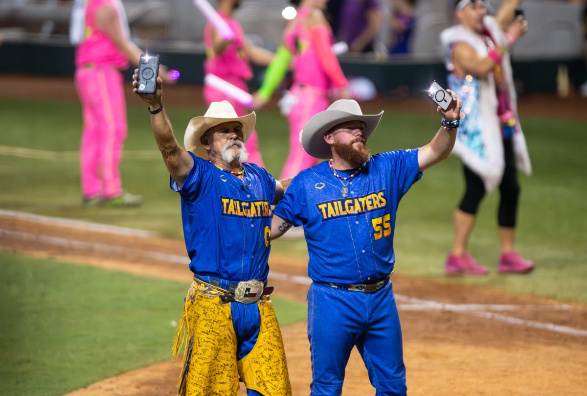 Texas Tailgaters sing along to music Friday, Aug 8, 2025, at Alex Box Stadium in Baton Rouge, La.